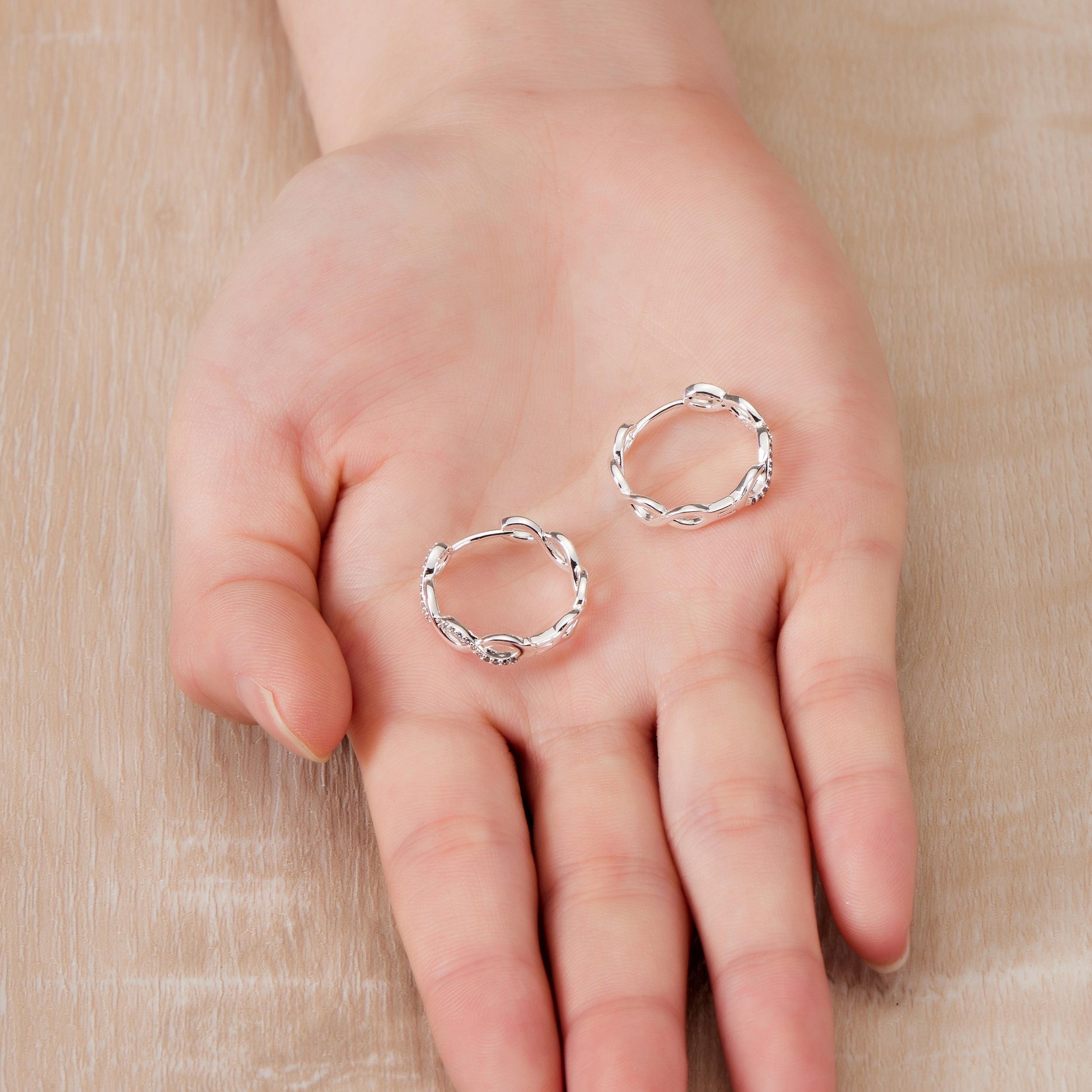 Silver Plated Infinity Hoop Earrings Created with Zircondia® Crystals