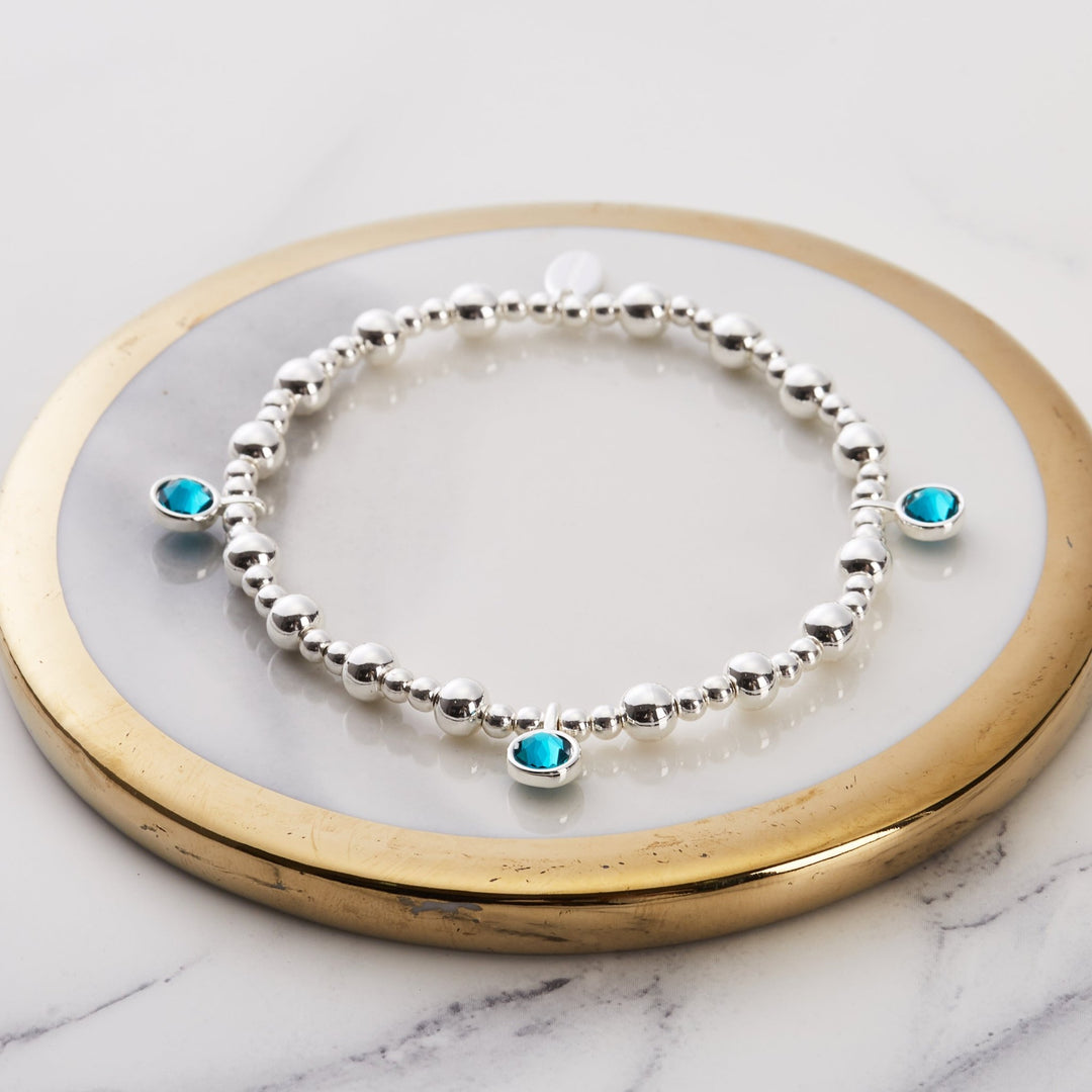 December (Blue Topaz) Birthstone Stretch Charm Bracelet with Quote Gift Box - Philip Jones Jewellery