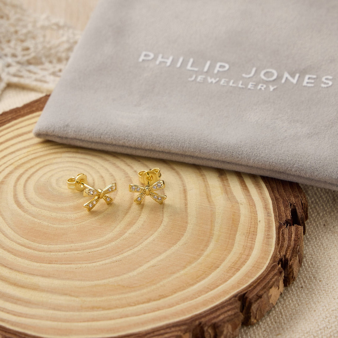 Gold Plated Bow Earrings Created with Zircondia® Crystals - Philip Jones Jewellery