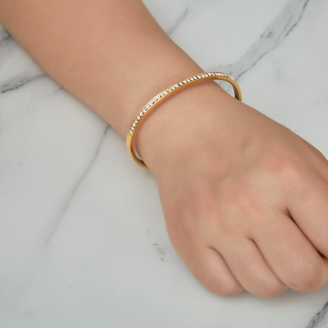 Gold Plated Stainless Steel Channel Set Bangle Created with Zircondia® Crystals (7 Inch) - Philip Jones Jewellery