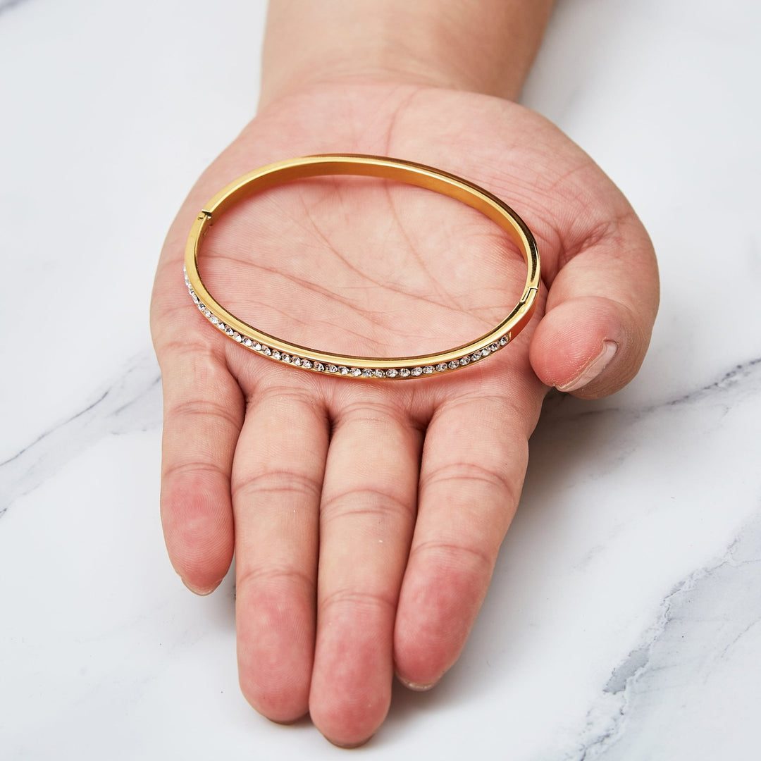 Gold Plated Stainless Steel Channel Set Bangle Created with Zircondia® Crystals (7 Inch) - Philip Jones Jewellery