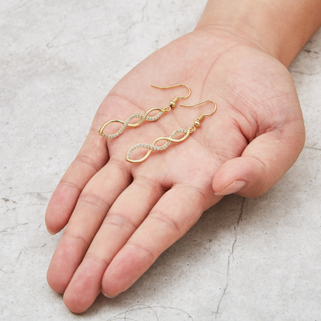 Gold Plated Twist Drop Earrings Created with Zircondia® Crystals - Philip Jones Jewellery