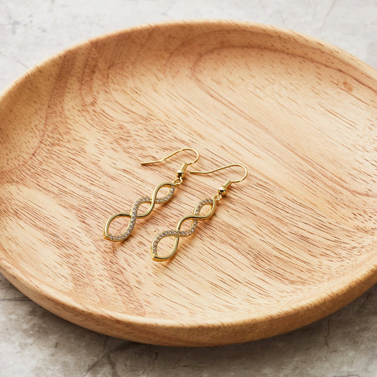 Gold Plated Twist Drop Earrings Created with Zircondia® Crystals - Philip Jones Jewellery