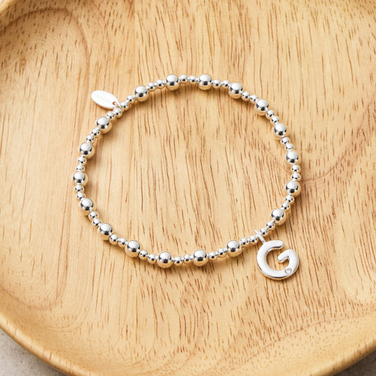 Letter G Initial Stretch Bracelet Created with Zircondia® Crystals - Philip Jones Jewellery