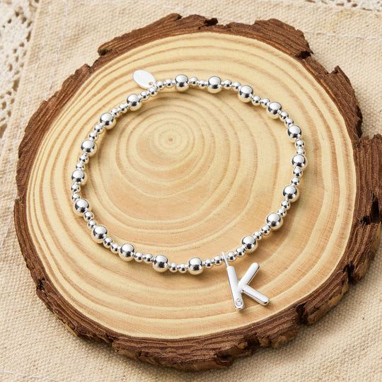 Letter K Initial Stretch Bracelet Created with Zircondia® Crystals - Philip Jones Jewellery