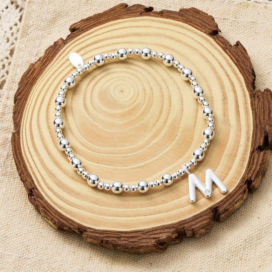 Letter M Initial Stretch Bracelet Created with Zircondia® Crystals - Philip Jones Jewellery
