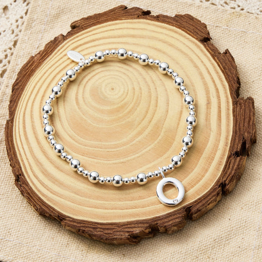 Letter O Initial Stretch Bracelet Created with Zircondia® Crystals - Philip Jones Jewellery