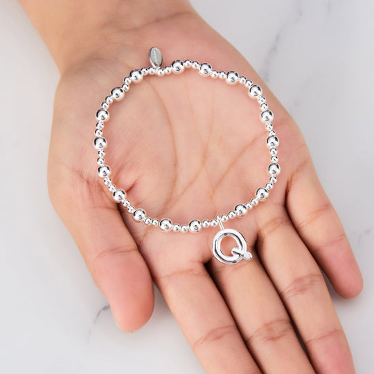 Letter Q Initial Stretch Bracelet Created with Zircondia® Crystals - Philip Jones Jewellery