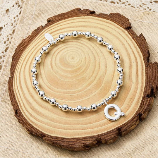 Letter Q Initial Stretch Bracelet Created with Zircondia® Crystals - Philip Jones Jewellery