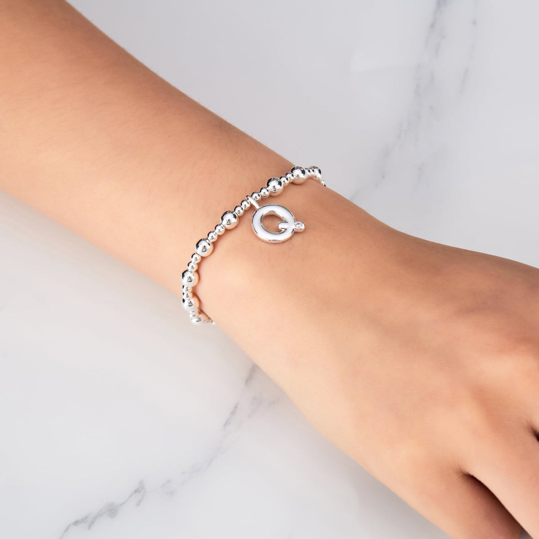 Letter Q Initial Stretch Bracelet Created with Zircondia® Crystals - Philip Jones Jewellery