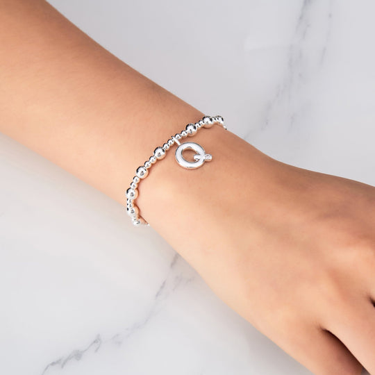 Letter Q Initial Stretch Bracelet Created with Zircondia® Crystals - Philip Jones Jewellery