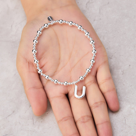 Letter U Initial Stretch Bracelet Created with Zircondia® Crystals - Philip Jones Jewellery