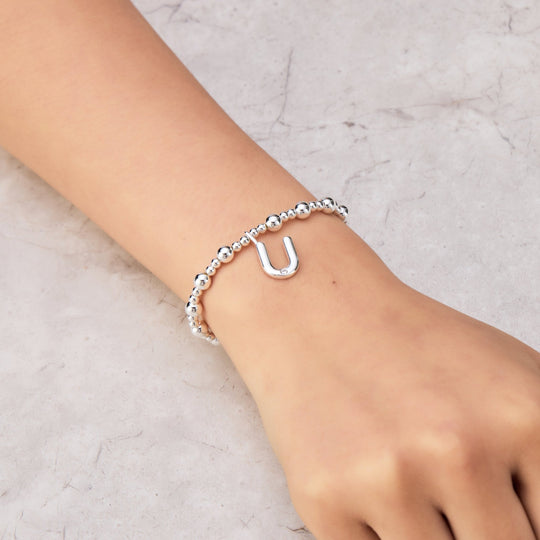 Letter U Initial Stretch Bracelet Created with Zircondia® Crystals - Philip Jones Jewellery