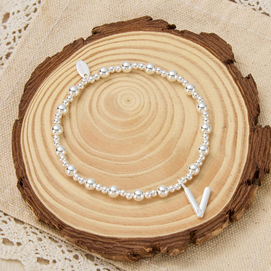 Letter V Initial Stretch Bracelet Created with Zircondia® Crystals - Philip Jones Jewellery