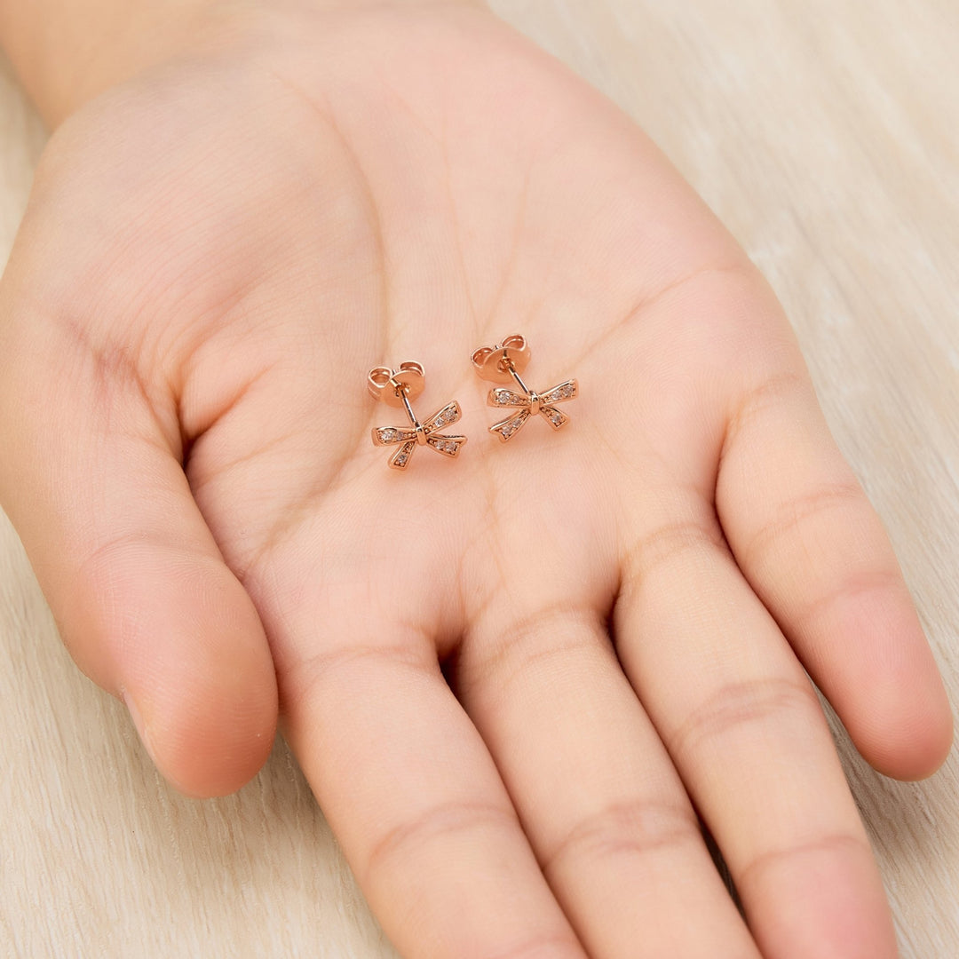 Rose Gold Plated Bow Earrings Created with Zircondia® Crystals - Philip Jones Jewellery
