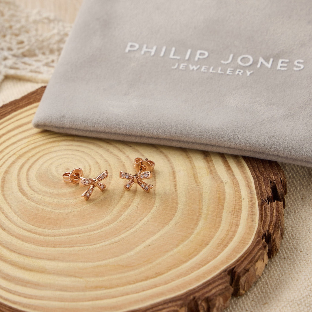 Rose Gold Plated Bow Earrings Created with Zircondia® Crystals - Philip Jones Jewellery