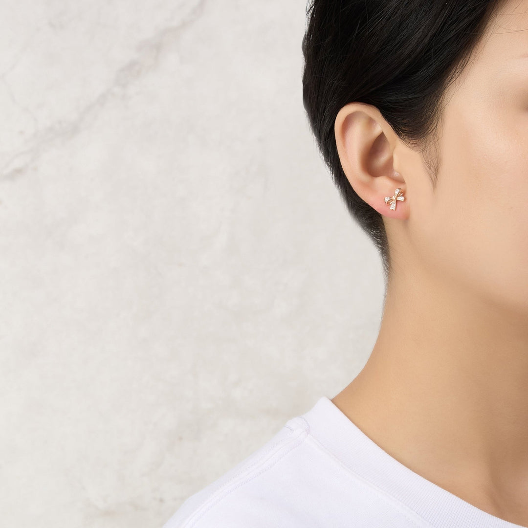 Rose Gold Plated Bow Earrings Created with Zircondia® Crystals - Philip Jones Jewellery