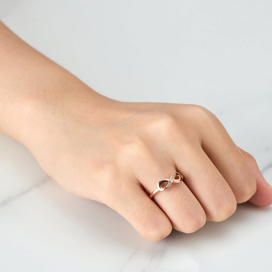 Rose Gold Plated Infinity Ring Created with Zircondia® Crystals - Philip Jones Jewellery