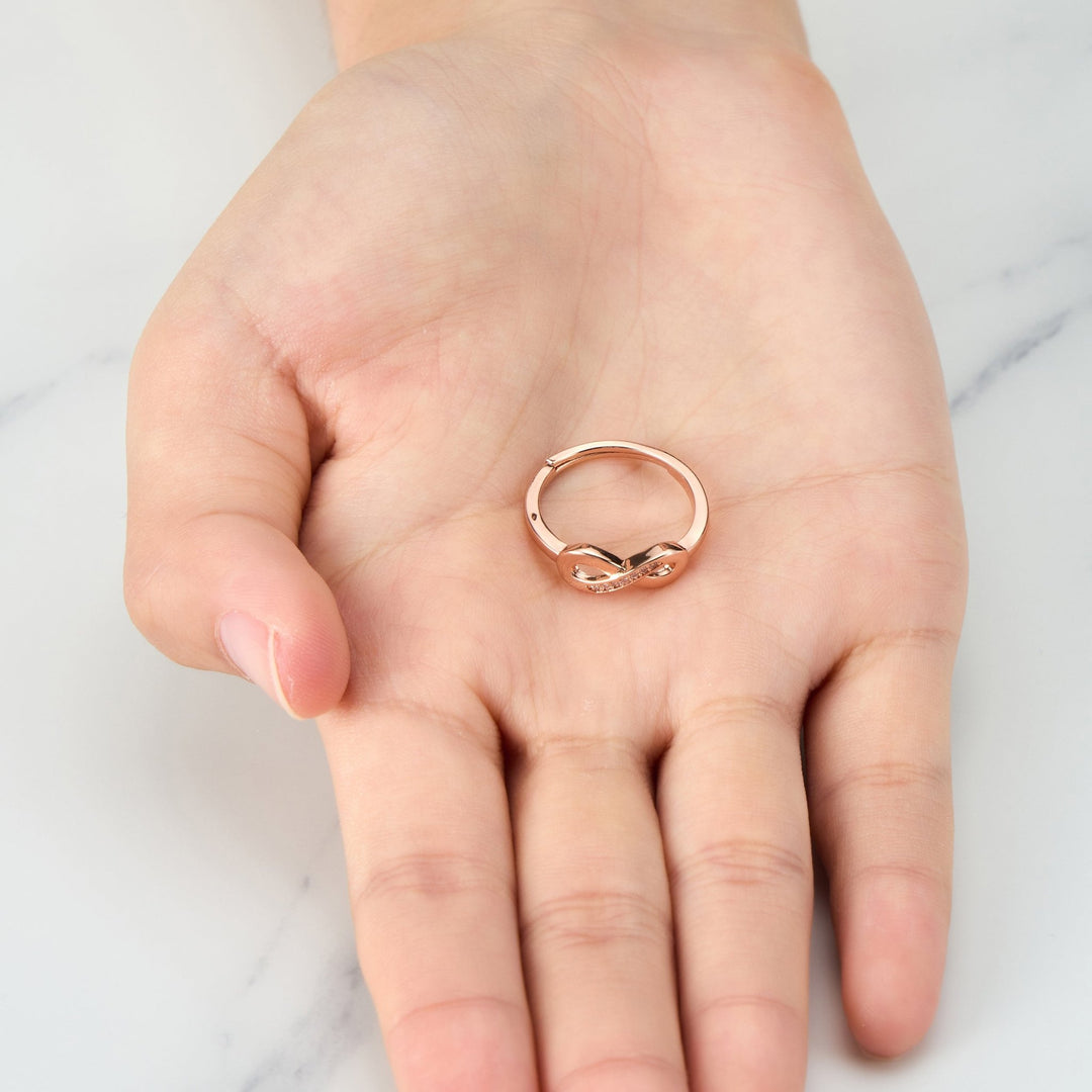 Rose Gold Plated Infinity Ring Created with Zircondia® Crystals - Philip Jones Jewellery