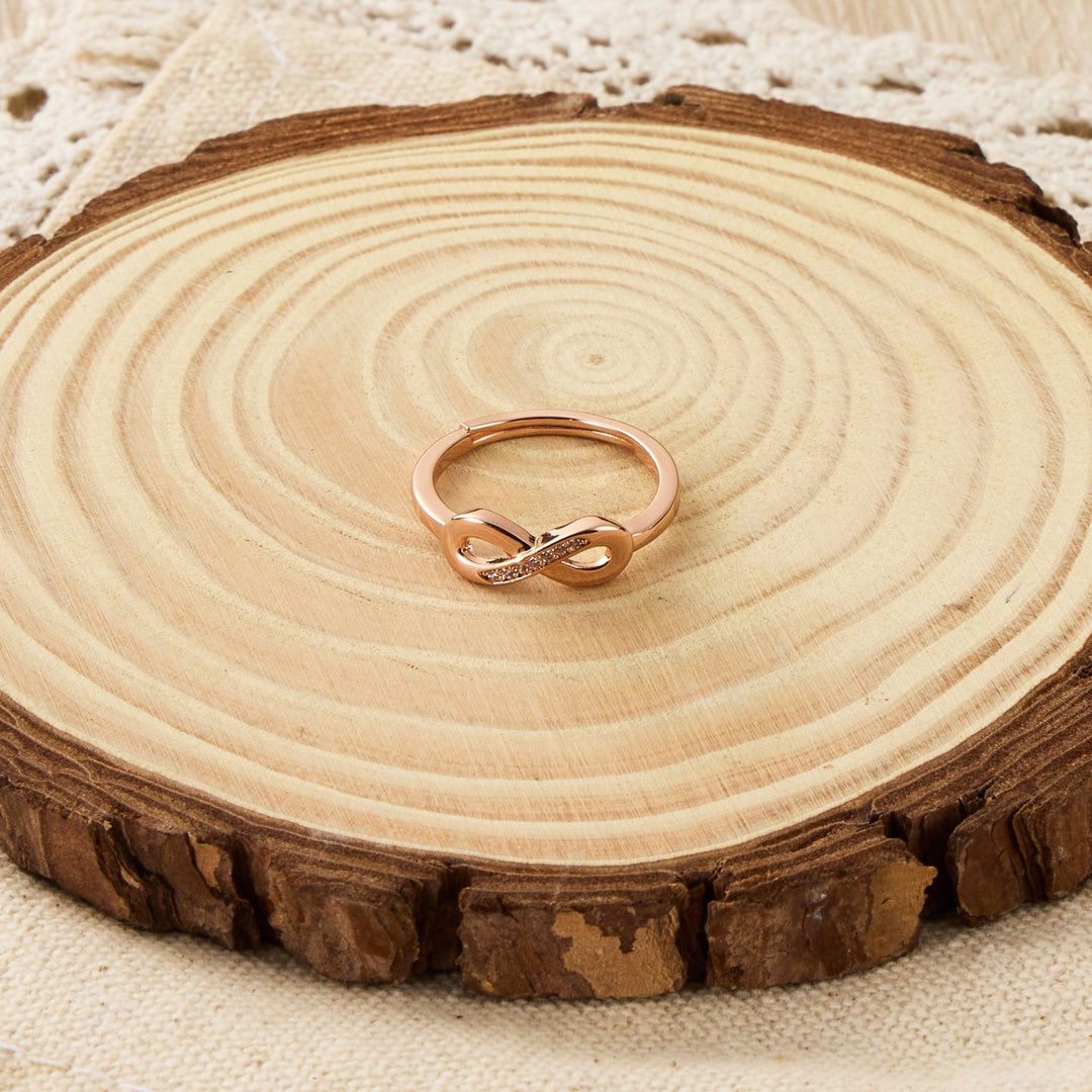 Rose Gold Plated Infinity Ring Created with Zircondia® Crystals - Philip Jones Jewellery