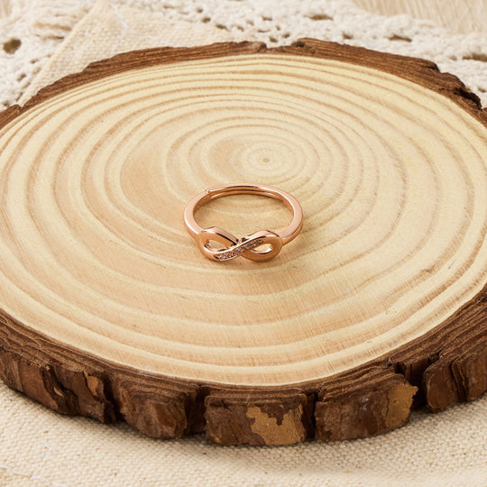Rose Gold Plated Infinity Ring Created with Zircondia® Crystals - Philip Jones Jewellery