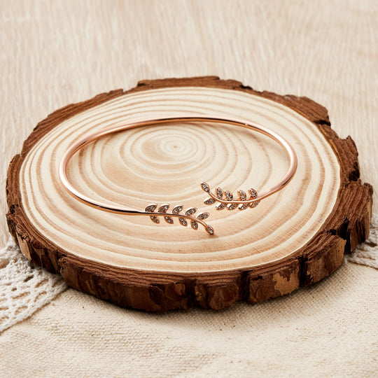 Rose Gold Plated Leaf Bangle Created with Zircondia® Crystals - Philip Jones Jewellery