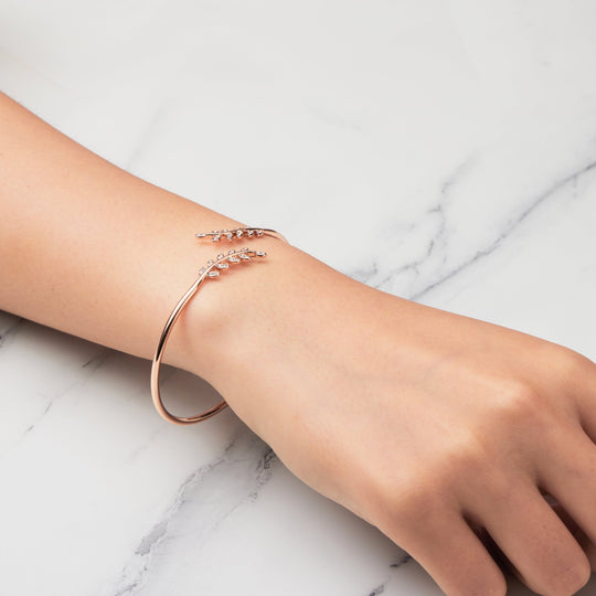 Rose Gold Plated Leaf Bangle Created with Zircondia® Crystals - Philip Jones Jewellery