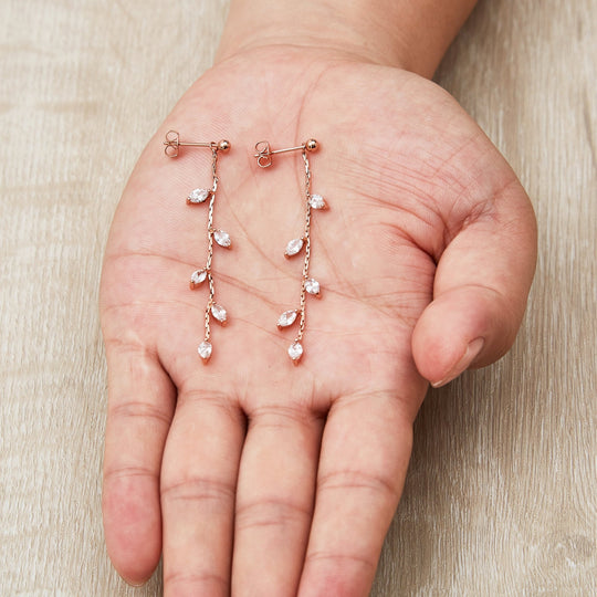 Rose Gold Plated Leaf Dangle Earrings Created with Zircondia® Crystals - Philip Jones Jewellery