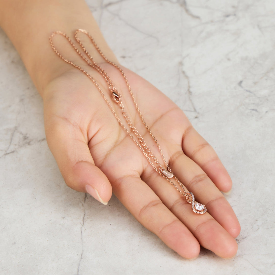 Rose Gold Plated Solitaire Twist Necklace Created with Zircondia® Crystals - Philip Jones Jewellery