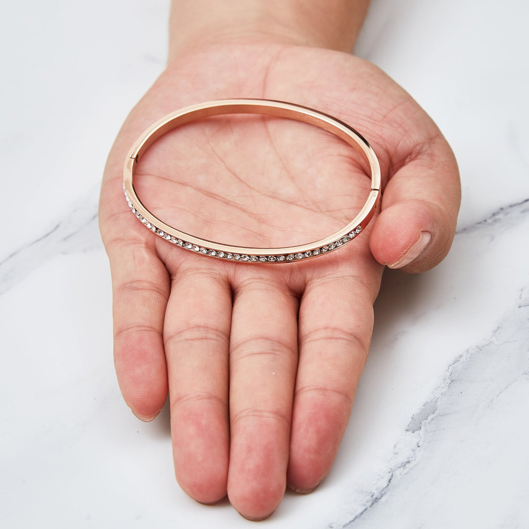 Rose Gold Plated Stainless Steel Channel Set Bangle Created with Zircondia® Crystals (7 Inch) - Philip Jones Jewellery