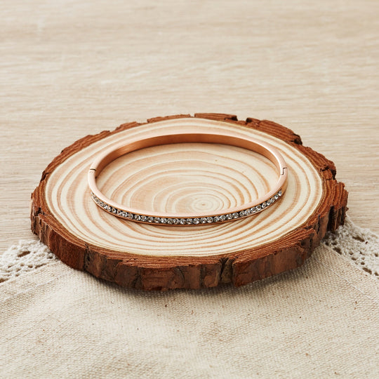 Rose Gold Plated Stainless Steel Channel Set Bangle Created with Zircondia® Crystals (7 Inch) - Philip Jones Jewellery