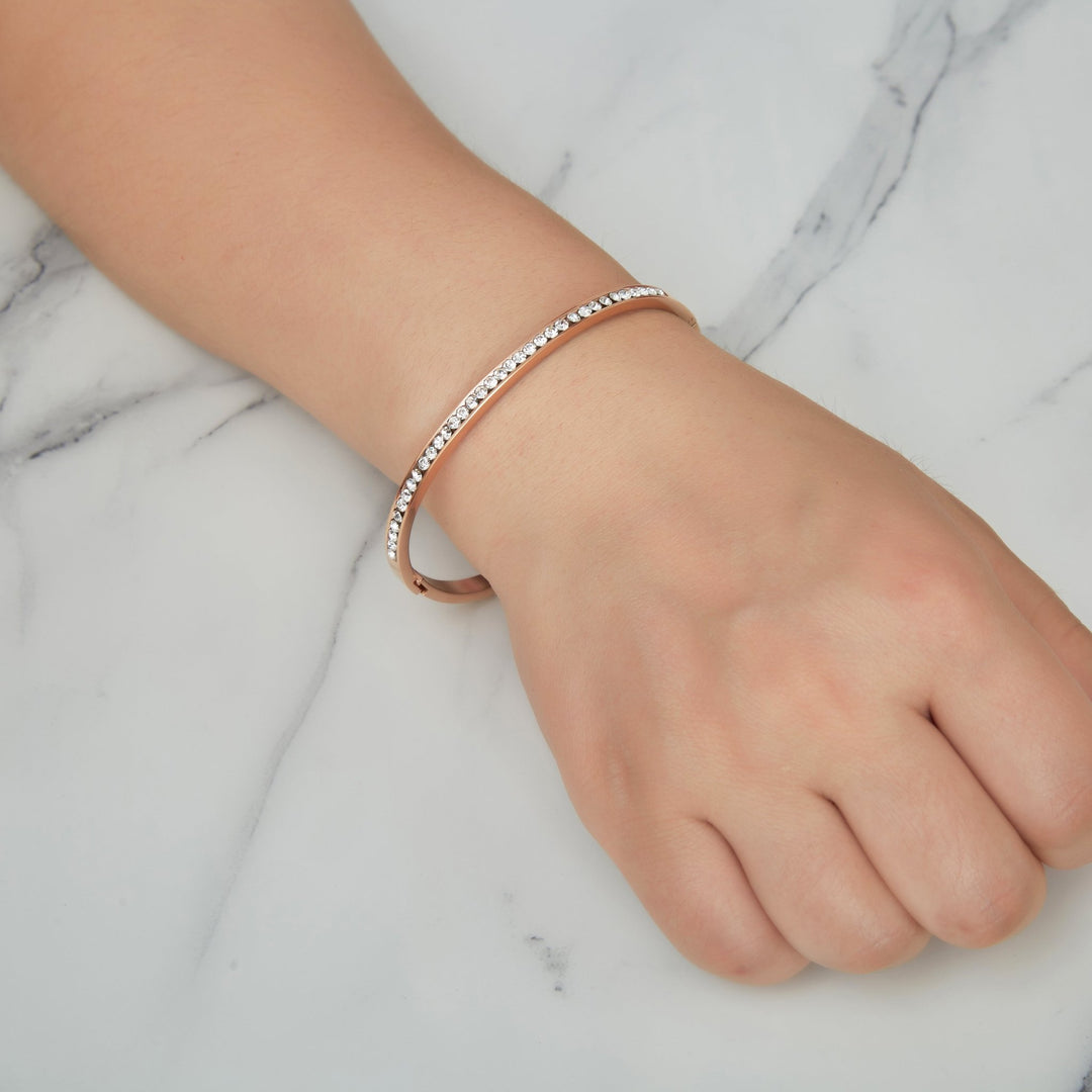 Rose Gold Plated Stainless Steel Channel Set Bangle Created with Zircondia® Crystals (7 Inch) - Philip Jones Jewellery