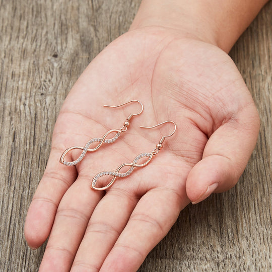 Rose Gold Plated Twist Drop Earrings Created with Zircondia® Crystals - Philip Jones Jewellery
