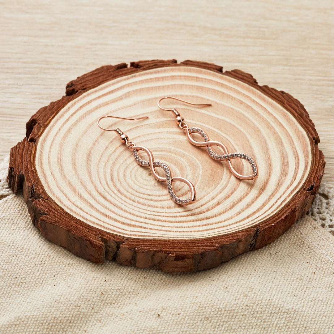 Rose Gold Plated Twist Drop Earrings Created with Zircondia® Crystals - Philip Jones Jewellery