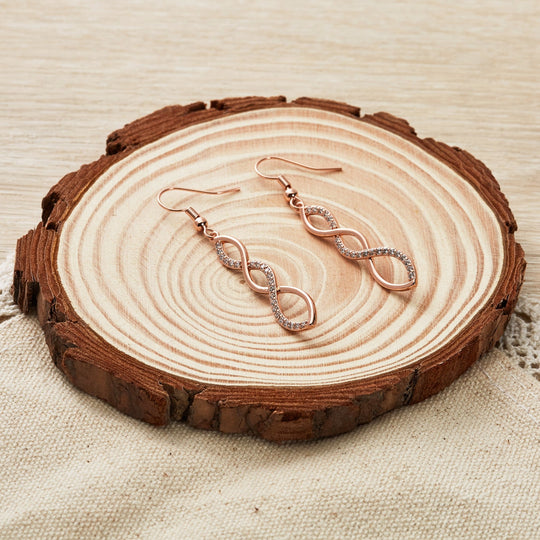 Rose Gold Plated Twist Drop Earrings Created with Zircondia® Crystals - Philip Jones Jewellery