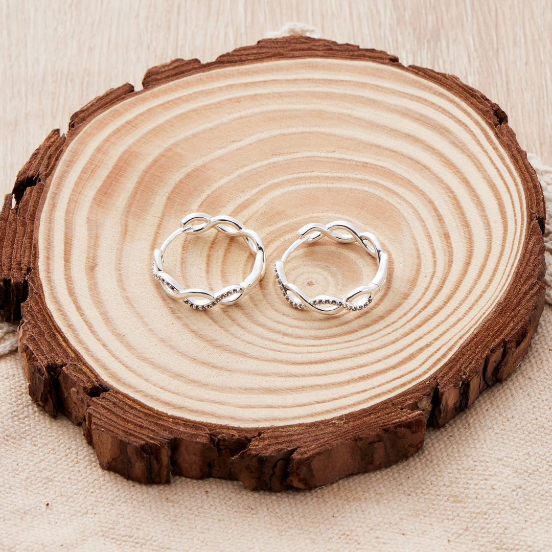 Silver Plated Infinity Hoop Earrings Created with Zircondia® Crystals - Philip Jones Jewellery