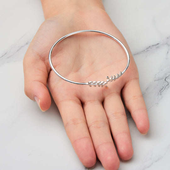 Silver Plated Leaf Bangle Created with Zircondia® Crystals - Philip Jones Jewellery