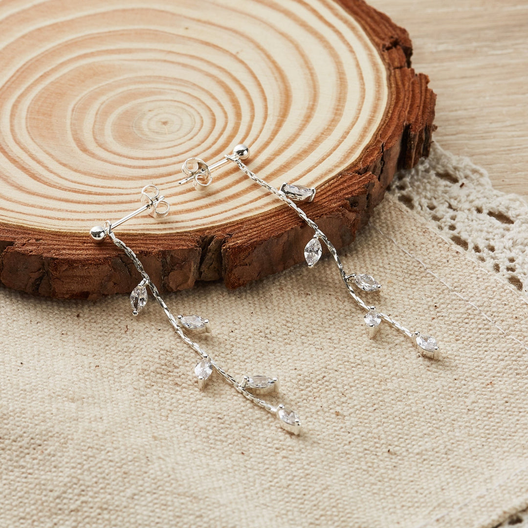 Silver Plated Leaf Dangle Earrings Created with Zircondia® Crystals - Philip Jones Jewellery