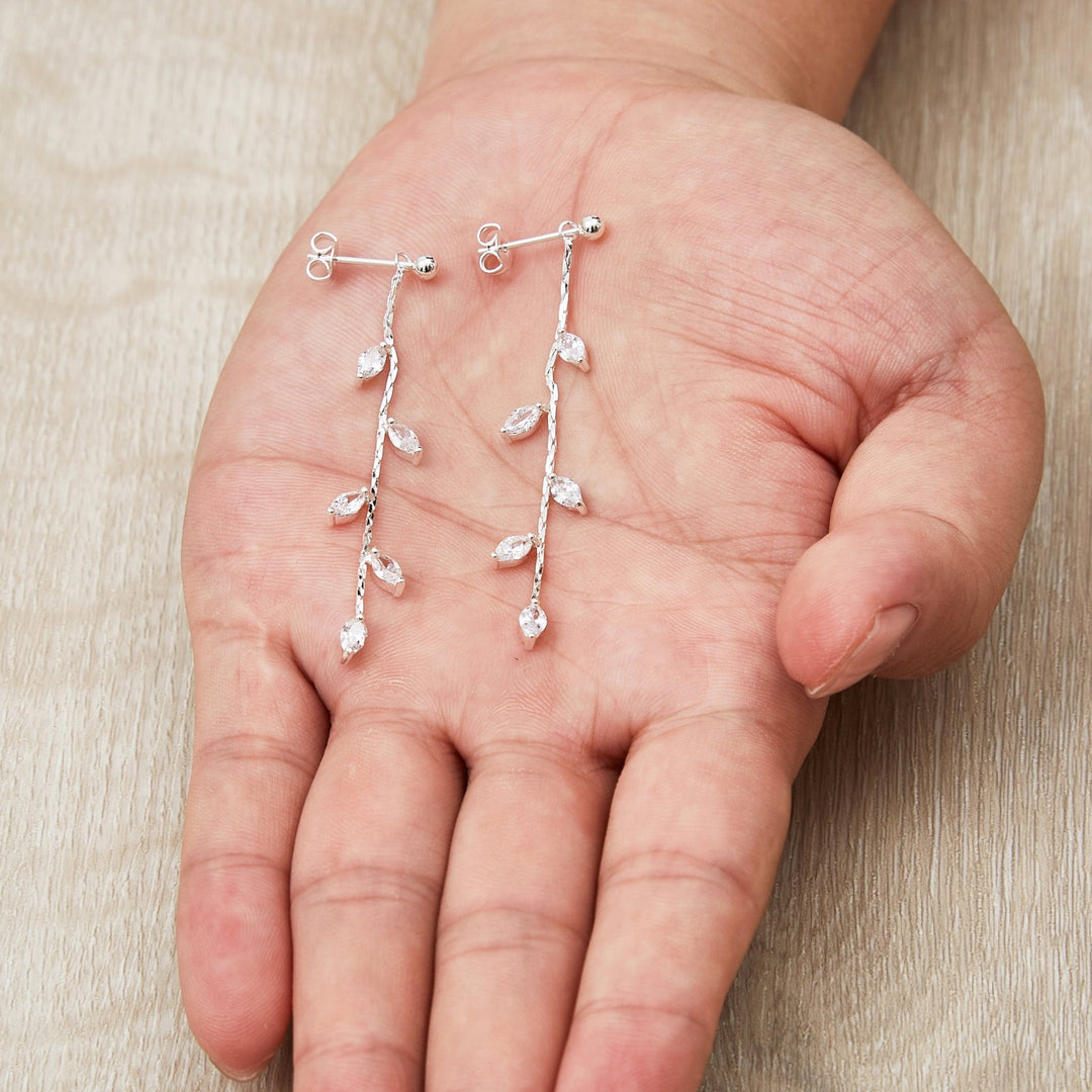 Silver Plated Leaf Dangle Earrings Created with Zircondia® Crystals - Philip Jones Jewellery