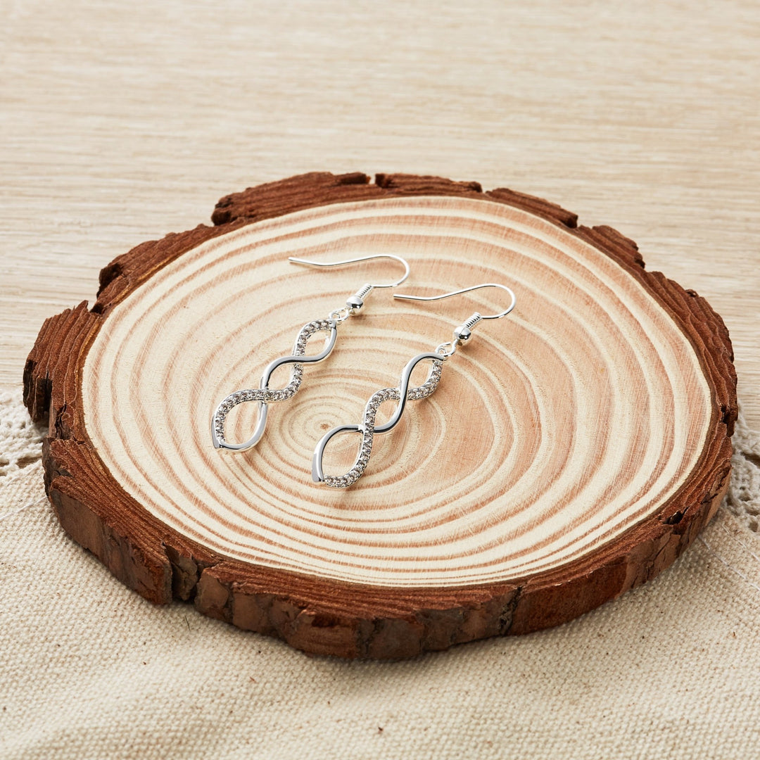 Silver Plated Twist Drop Earrings Created with Zircondia® Crystals - Philip Jones Jewellery