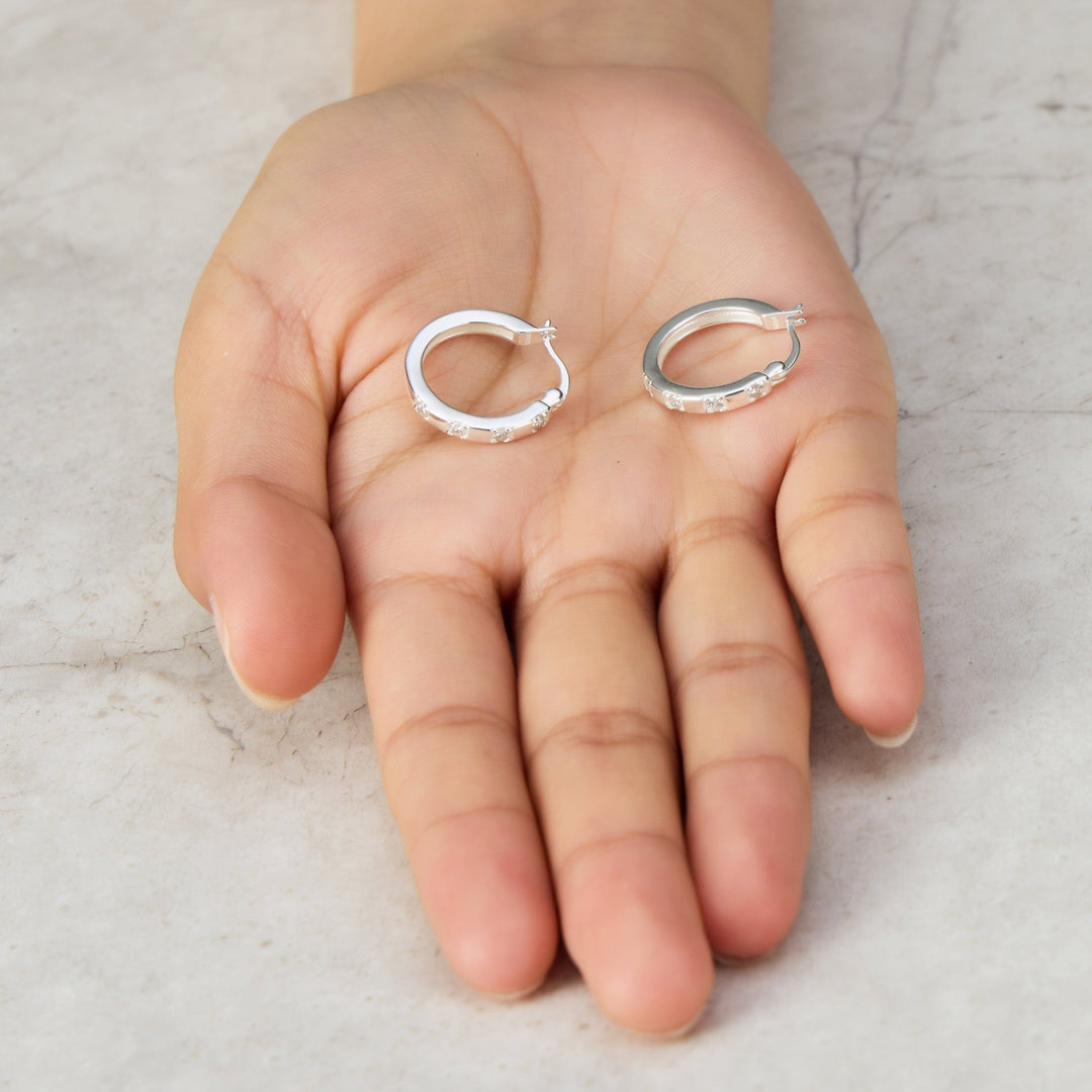 Sterling Silver Four Stone Hoop Earrings Created with Zircondia® Crystals - Philip Jones Jewellery