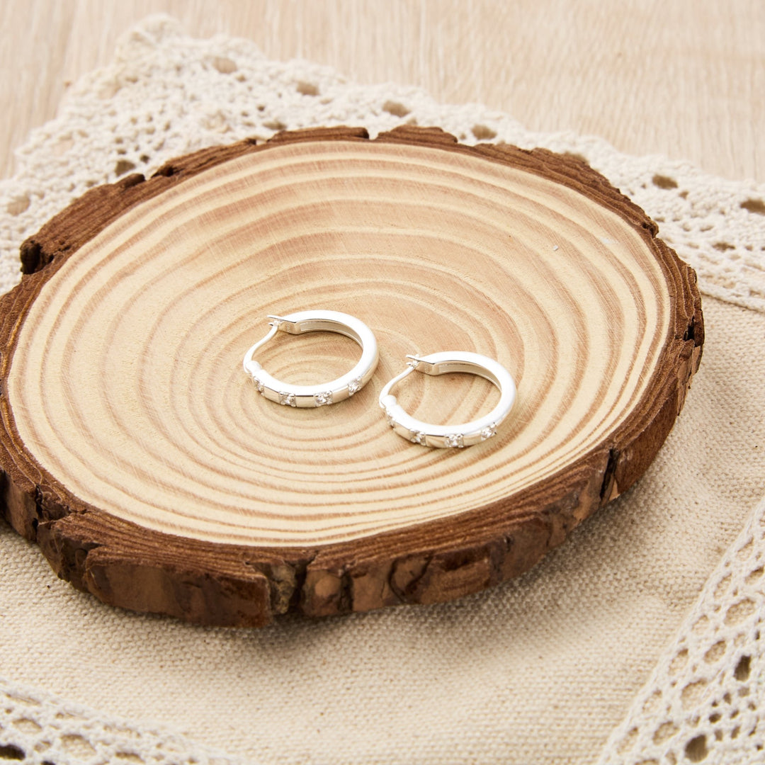 Sterling Silver Four Stone Hoop Earrings Created with Zircondia® Crystals - Philip Jones Jewellery