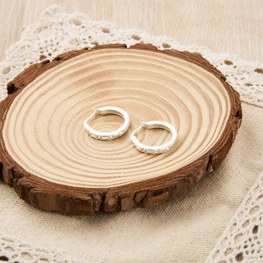 Sterling Silver Four Stone Hoop Earrings Created with Zircondia® Crystals - Philip Jones Jewellery