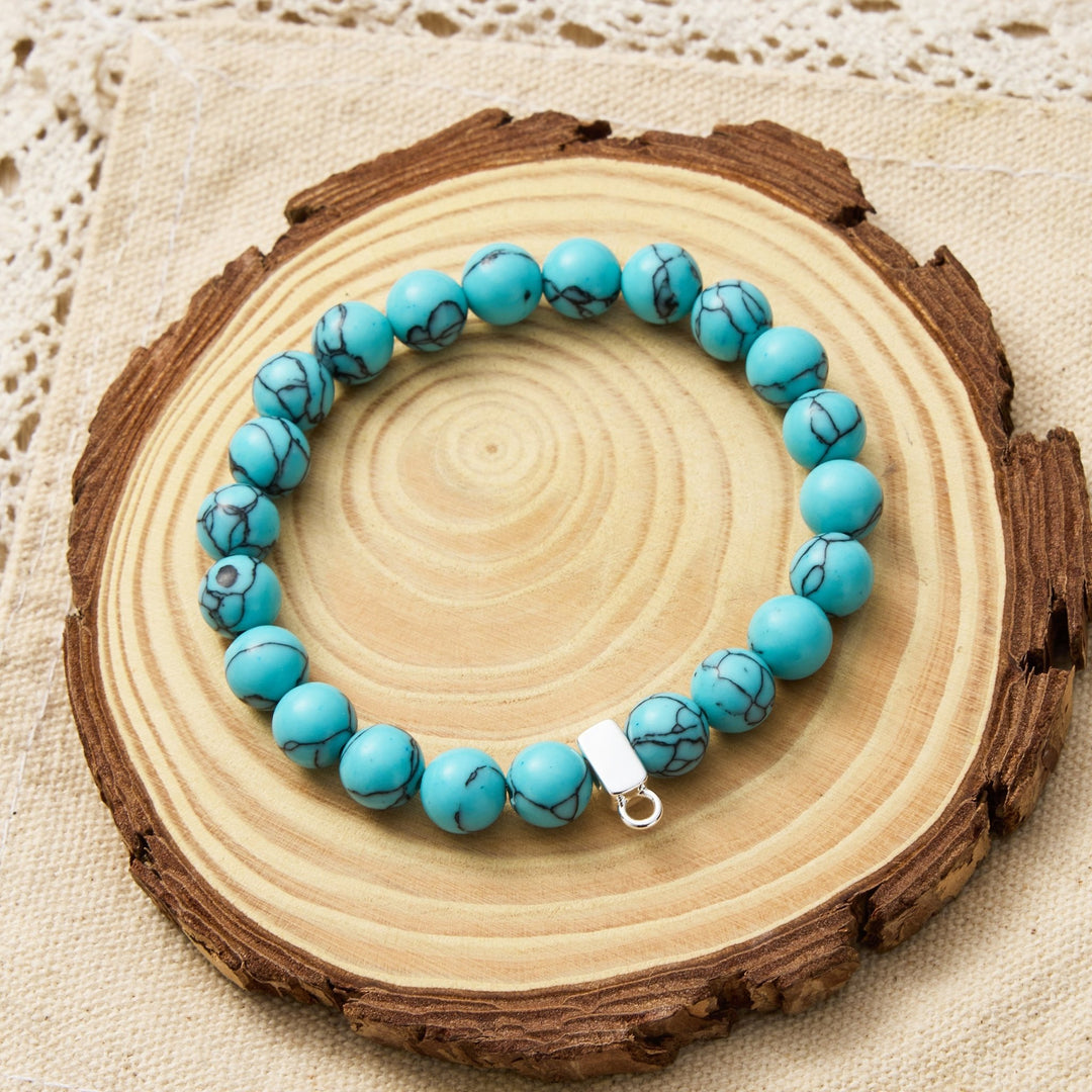 Synthetic Turquoise Gemstone Stretch Bracelet with Charm Created with Zircondia® Crystals - Philip Jones Jewellery