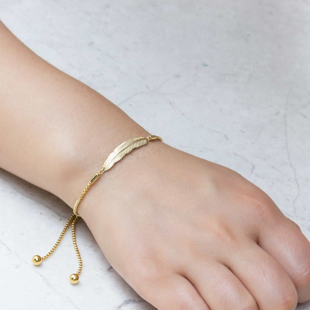 Gold Plated Feather Friendship Bracelet Created with Zircondia® Crystals - Philip Jones Jewellery