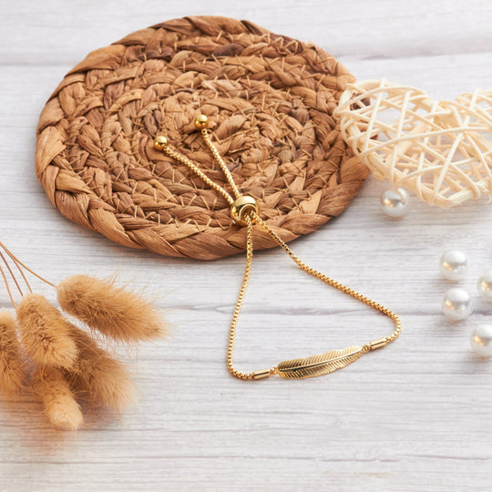Gold Plated Feather Friendship Bracelet Created with Zircondia® Crystals - Philip Jones Jewellery