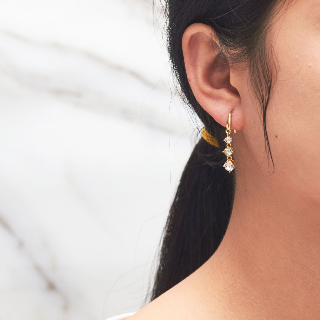 Gold Plated Graduated Drop Earrings Created with Zircondia® Crystals - Philip Jones Jewellery