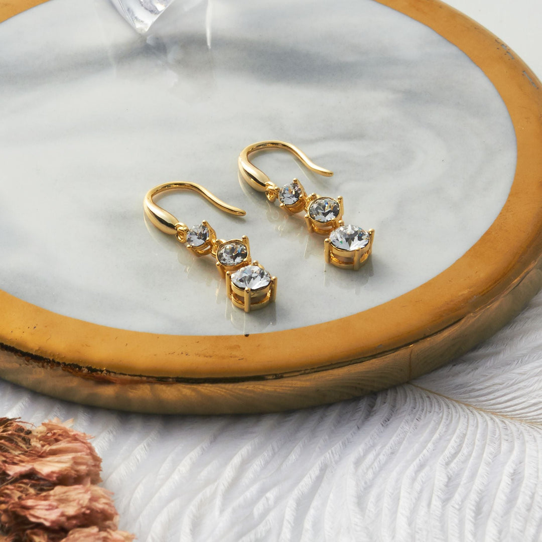 Gold Plated Graduated Drop Earrings Created with Zircondia® Crystals - Philip Jones Jewellery