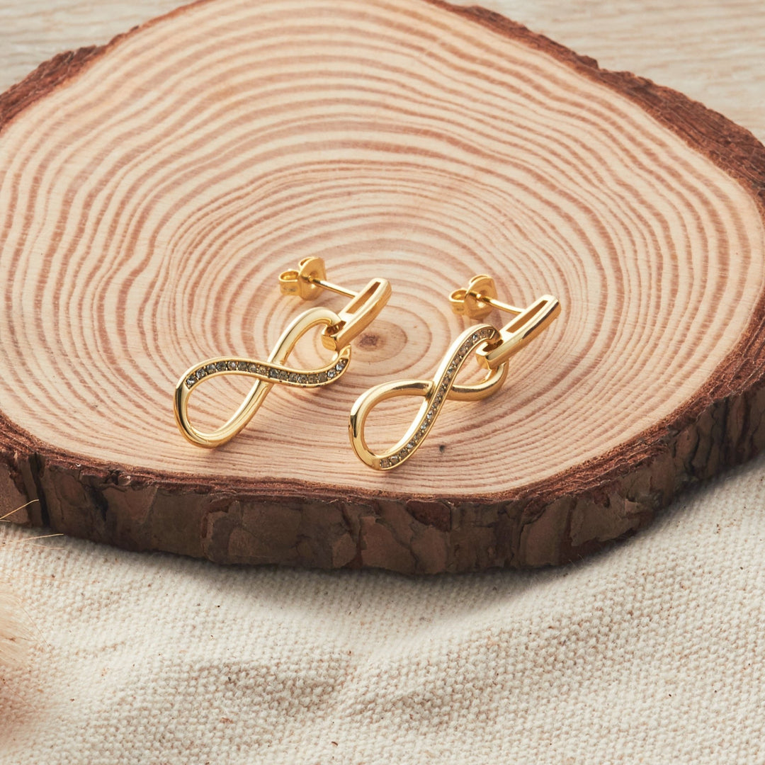 Gold Plated Infinity Drop Earrings Created with Zircondia® Crystals - Philip Jones Jewellery