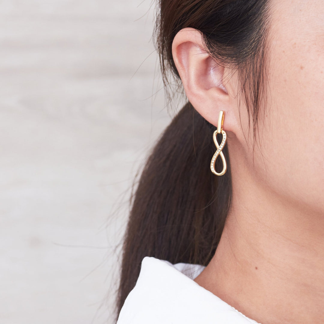 Gold Plated Infinity Drop Earrings Created with Zircondia® Crystals - Philip Jones Jewellery